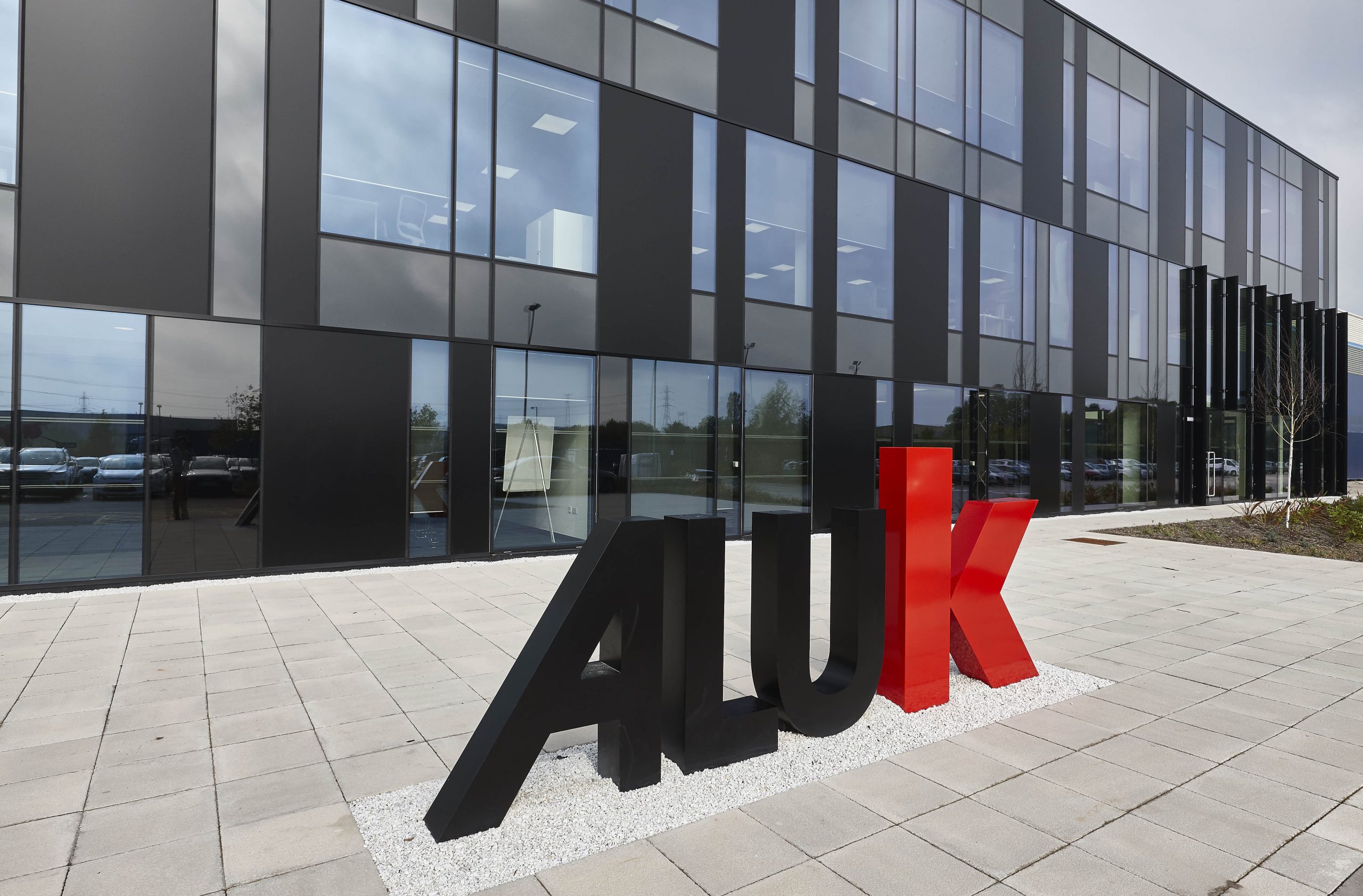 Aluk Logo in front of headquarters in UK